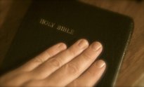 Hand on Bible